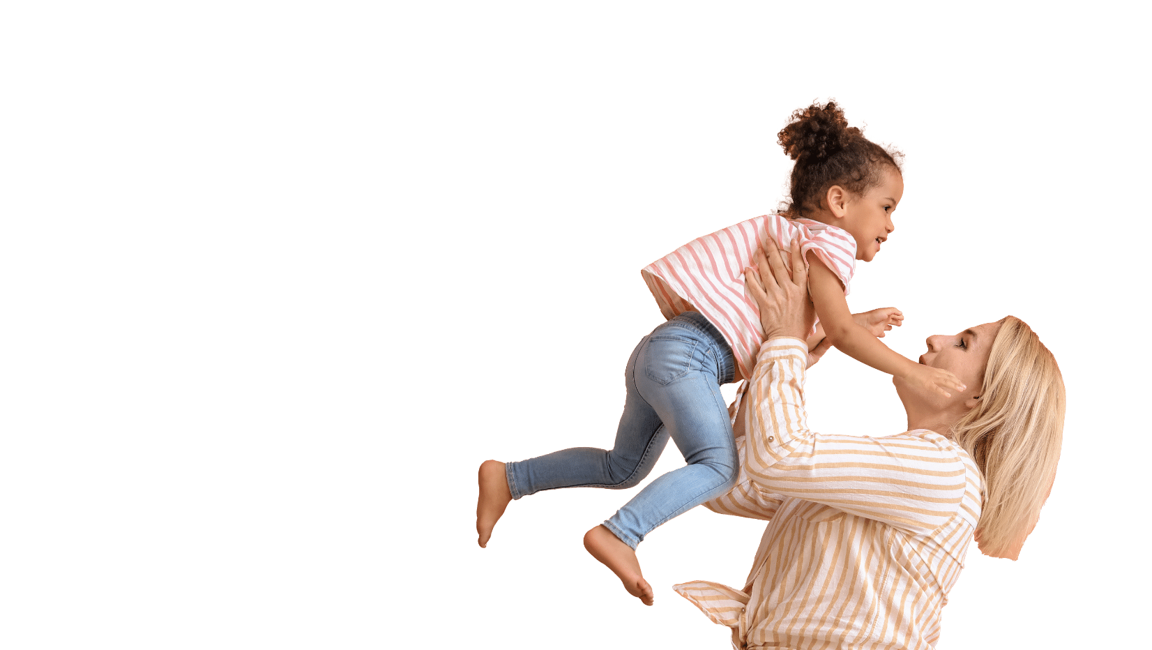 A woman picking up a little girl