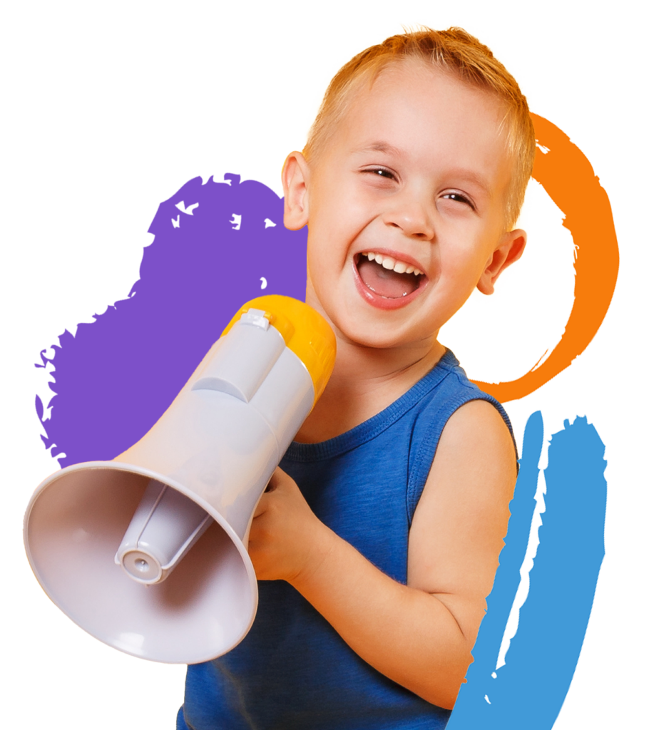 A little boy holding a megaphone and laughing