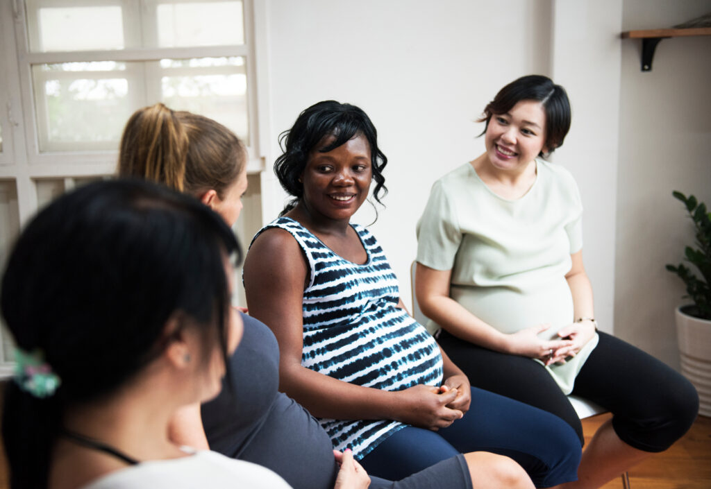 A group of pregnant women talking together