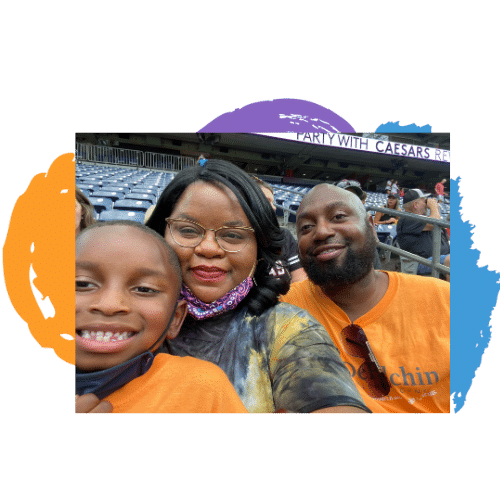 A couple taking a picture at a stadium