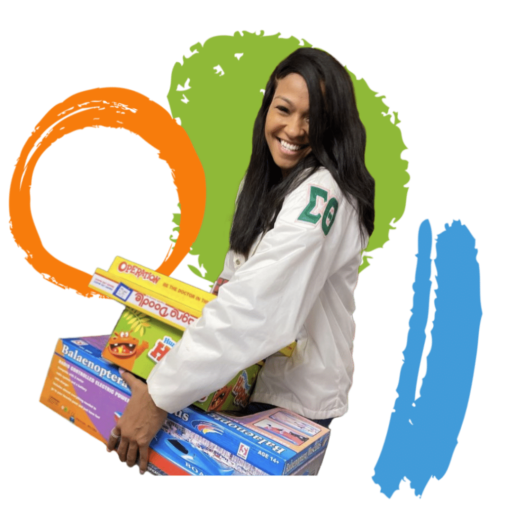 A young lady holding a bunch of boardgames