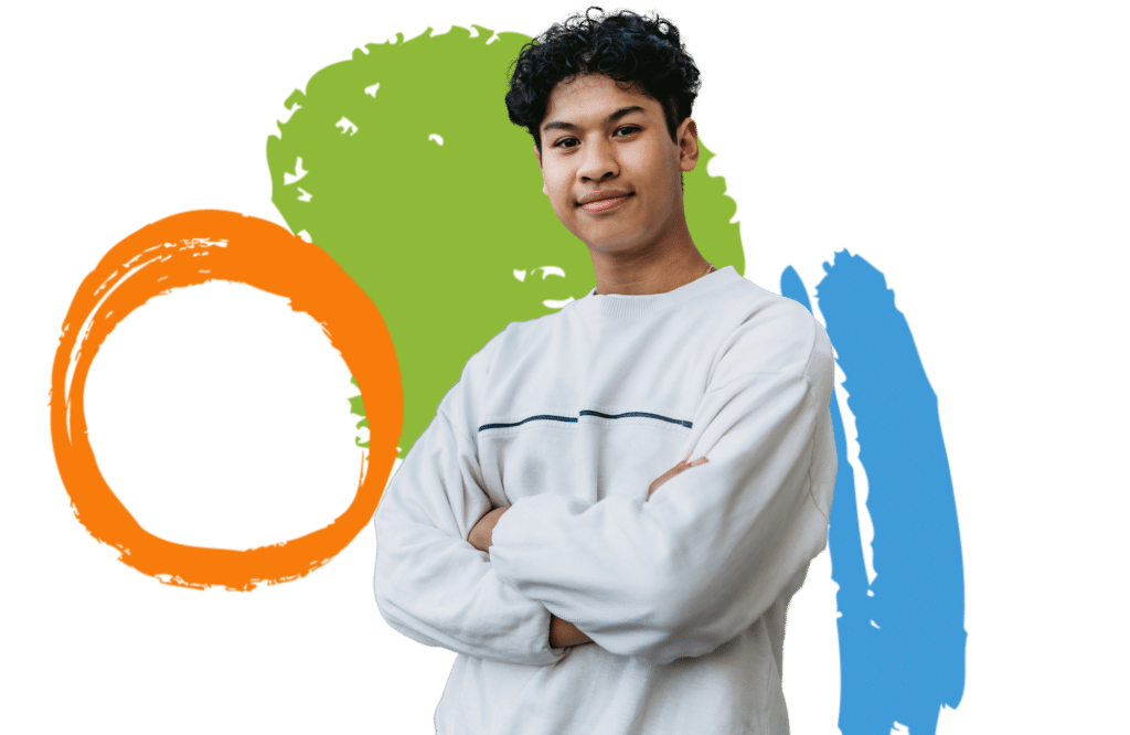 A teenager standing with his arms crossed