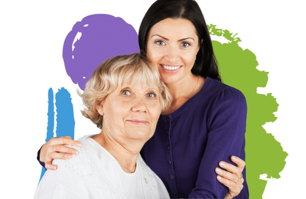 An elderly lady being embraced by a young lady