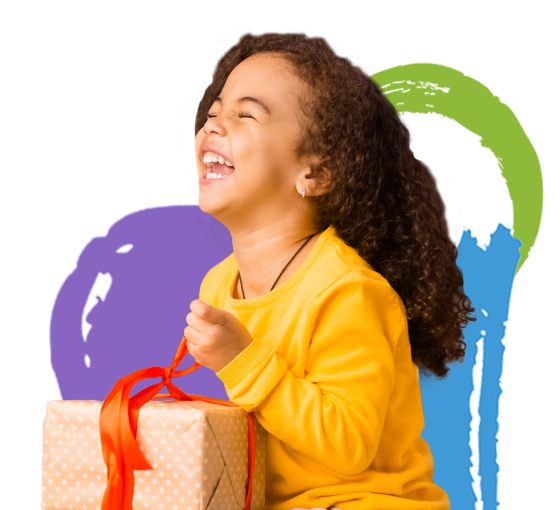 A little girl excitedly opening a gift